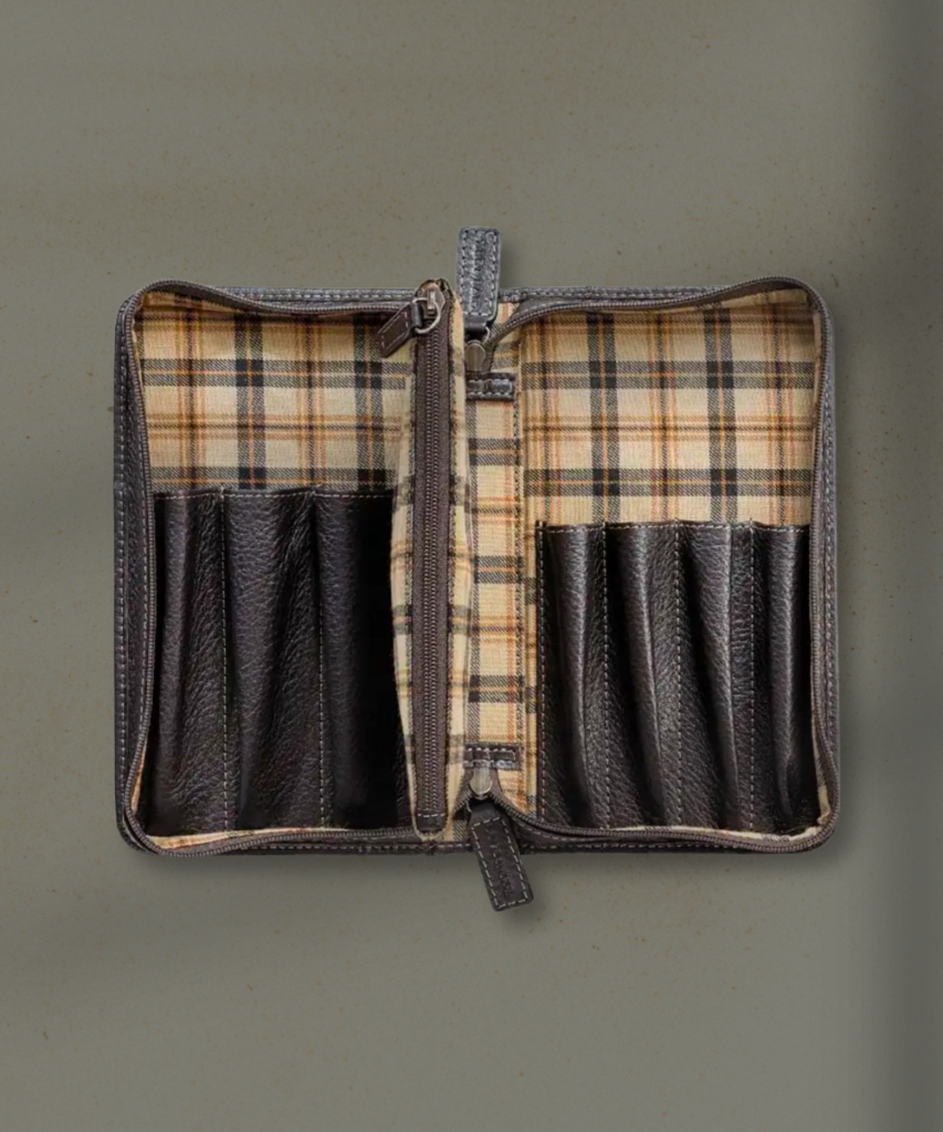 Open leather wallet with plaid fabric interior and multiple card slots on both sides