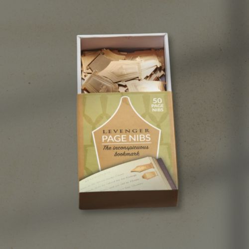 Open box of LeVenger Page Nibs on a gray surface, with small paper slips inside the box.