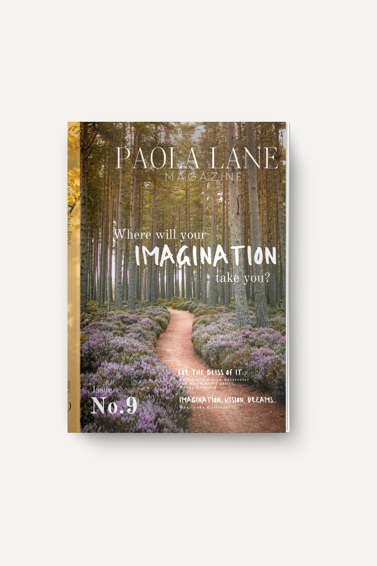 Paola Lane Magazine cover showing a forest path with purple flowers, title and tagline overlaid: 'Where will your imagination take you?'