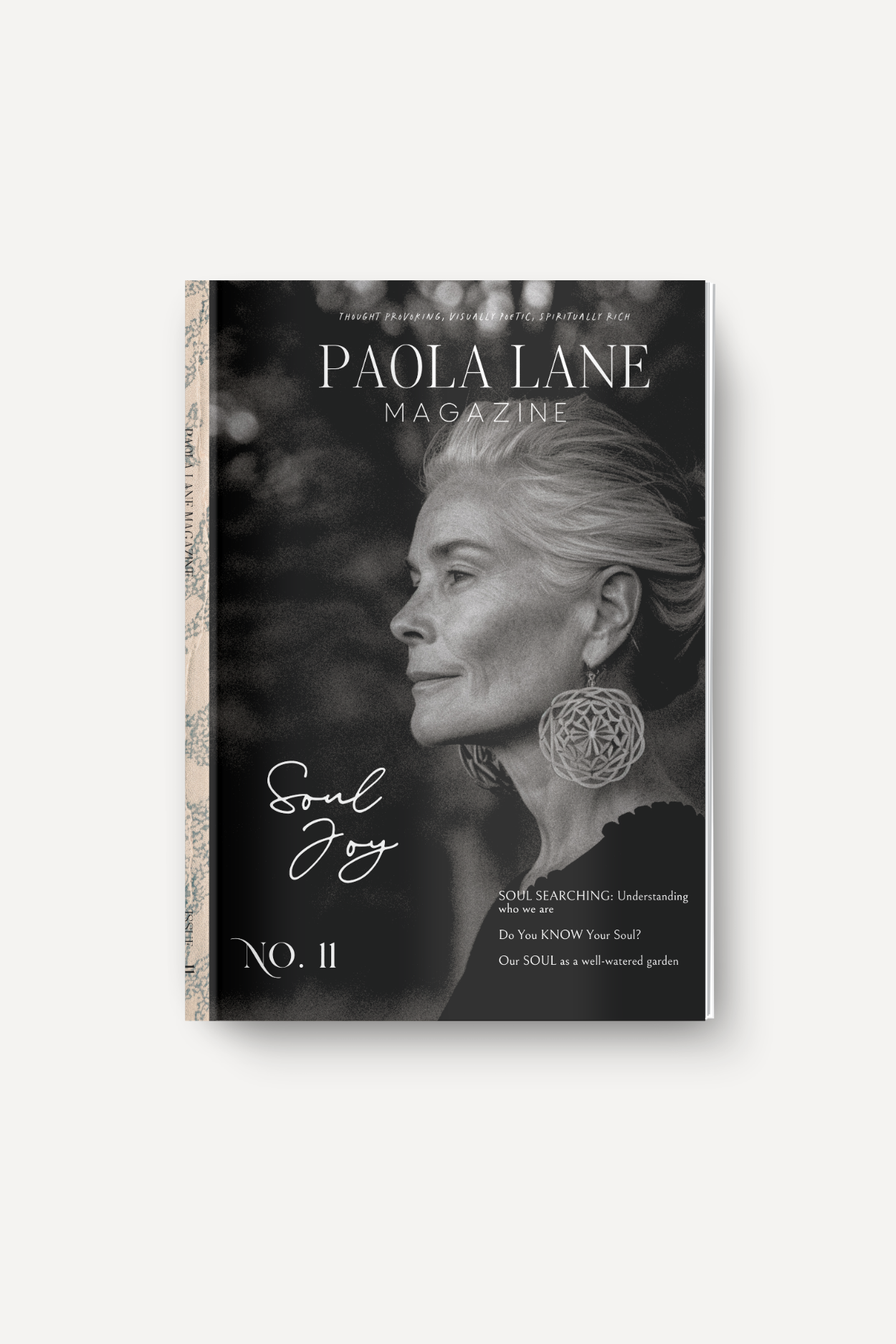 Paola Lane Magazine issue No. 11 cover showing a black-and-white side-profile portrait of an older woman wearing a large geometric earring, with the title 'Soul Joy' on the lower left and 'Paola Lane Magazine' at the top.