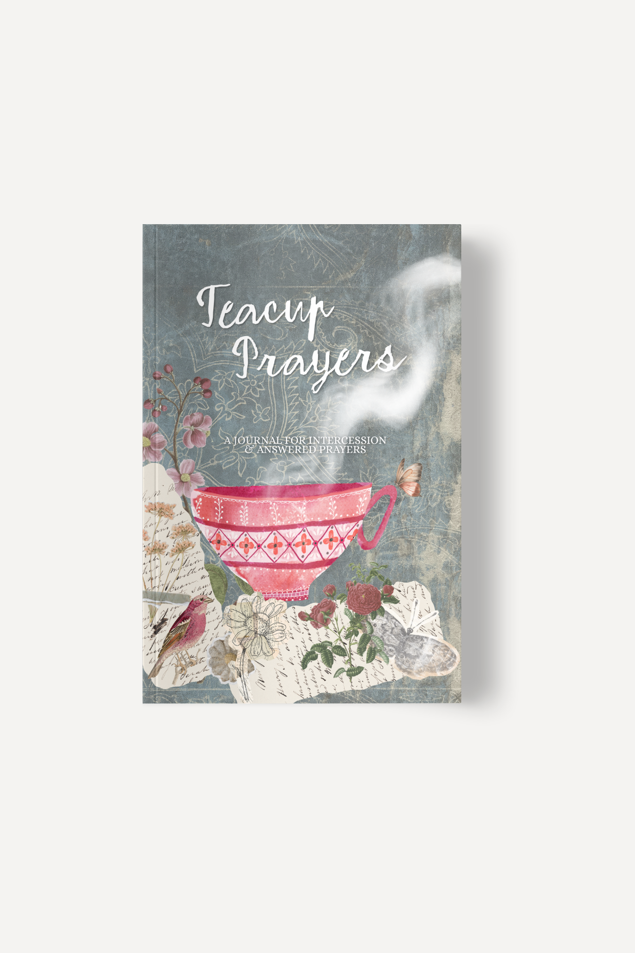 Book cover: Teacup Prayers, a journal for intercession and answered prayers, with a decorative teacup and floral collage on a blue-gray background.
