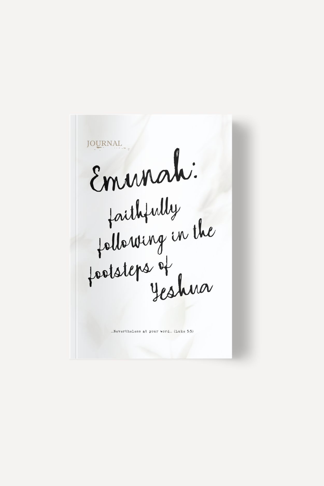 Book cover with handwritten title: "Emmah: faithfully following in the footsteps of Yeshua" and a small "Journal" label in the top left; light marbled background.