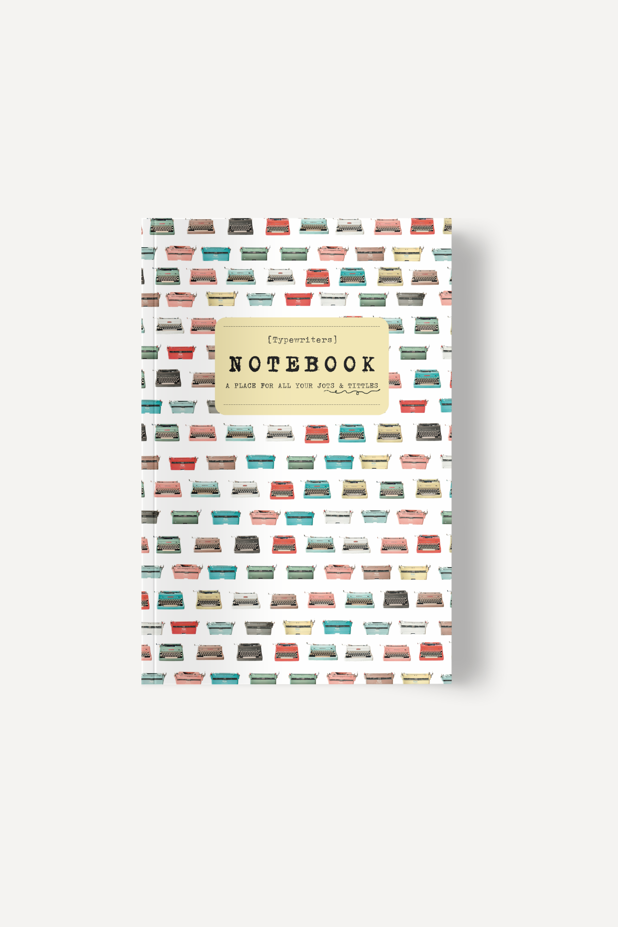 Notebook cover featuring a pastel beige label with '[Typewriters] NOTEBOOK' and 'A PLACE FOR ALL YOUR JOTS & TITLES' over a repeating pattern of colorful typewriters.