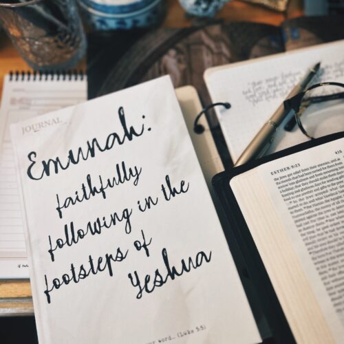 emunah journal on table with Bible